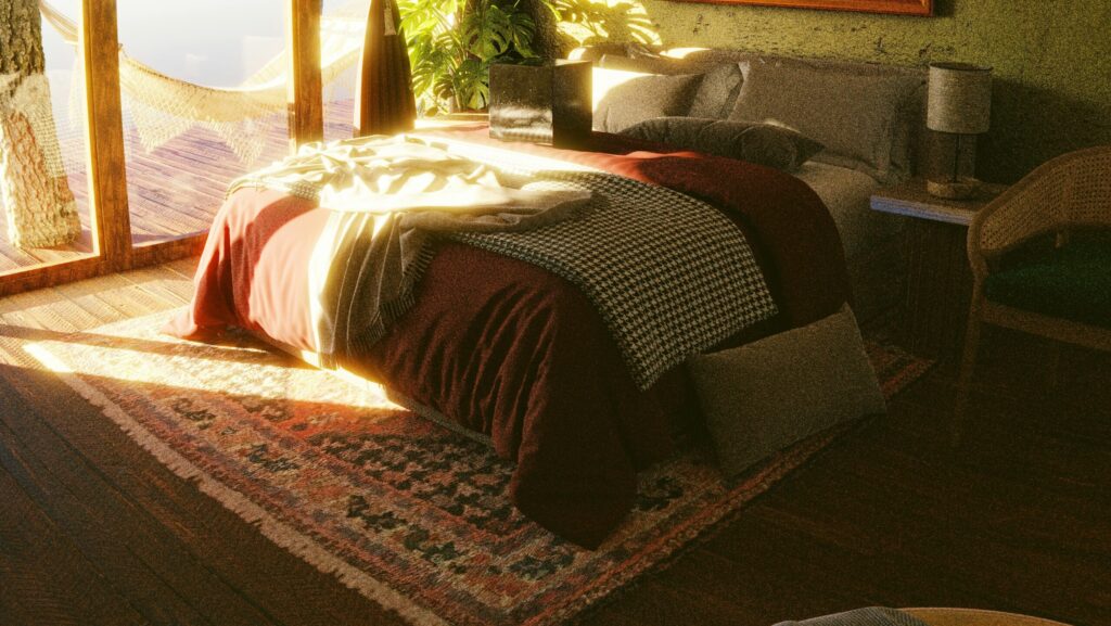 How To Choose The Perfect Rug For Your Bedroom A sunlit bedroom with a cozy hammock and scenic balcony, offering a relaxing escape.