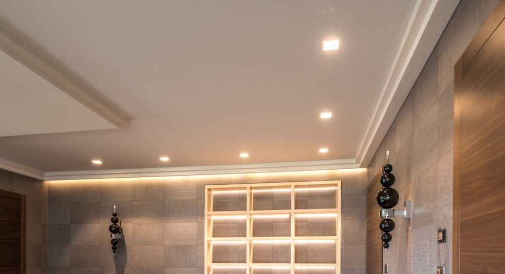 Spacious modern interior featuring wooden doors, flooring, and minimalistic design elements.